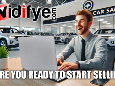 Car salesman happily using Vidifye on his laptop to create a video ad for a vehicle.